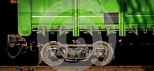 Abstract image of the wheels of a railway freight car on a track