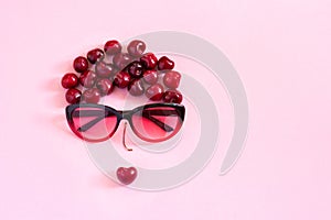 abstract image young woman from sweet cherry and glasses. Concept