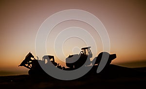 Abstract Industrial background with construction crane silhouette over amazing sunset sky. Mobile crane against the evening sky.