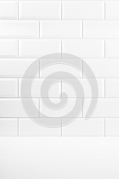 Abstract interior with white ceramic rectangle tiles on wall and wood floor or shelf, mockup, empty