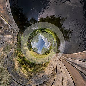 Abstract inversion of little planet transformation of spherical panorama 360 degrees. Spherical abstract aerial view on wooden