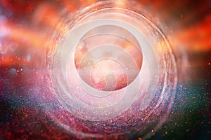 Abstract lens flare. concept image of space or time travel background over dark colors and bright lights.