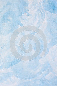 Abstract light blue watercolor background, painted on watercolor paper