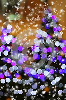 Abstract light bokeh on christmas tree with snow flake.