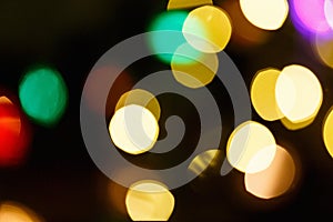 Abstract light celebration background with defocused golden lights for Christmas, New Year, Holiday