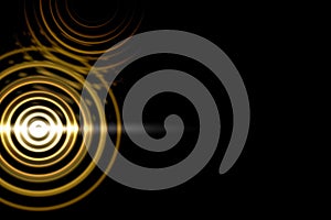 Abstract light circle effect with gold rings on black background