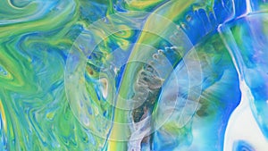 Abstract light pastel streams flow along the plane on a blue background. Marble texture. Fluid art. Liquid abstractions.