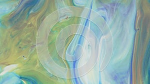 Abstract light pastel streams flow along the plane on a blue background. Marble texture. Fluid art. Liquid abstractions.