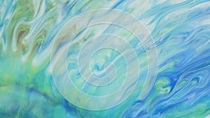 Abstract light pastel streams flow along the plane on a blue background. Marble texture. Fluid art. Liquid abstractions.