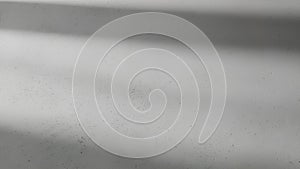 Abstract light and shadow pattern on textured surface