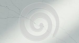 Abstract light and shadow play on a textured gray and white surface