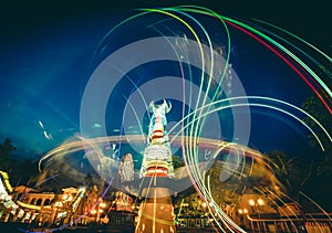 Abstract light trails of carousels