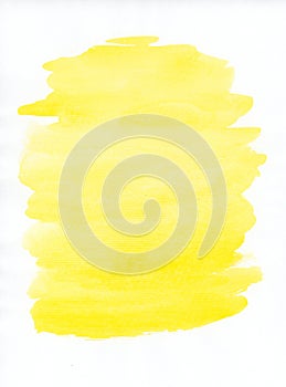 Abstract light-yellow spot of watercolor paint isolated on a white background. Visible stripes from a wide brush.
