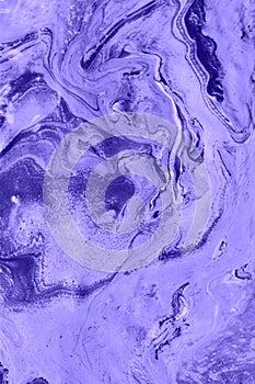 Abstract lilac marble background. Acrylic paint flows freely and creates an interesting pattern.