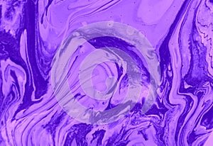 Abstract lilac marble background. Acrylic paint flows freely and creates an interesting pattern.