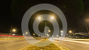 Abstract long exposure dynamic speed lights in the city with beautiful multi-colored lights, modern glitter in the night city photo