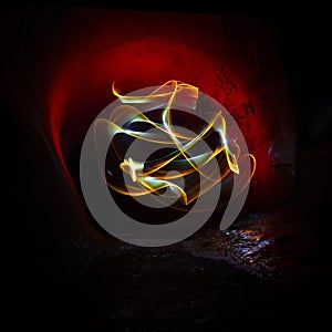 Abstract luminous light painting in the tunn