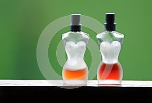 Abstract luxury French glass perfume bottles half filled of perfumes fragrances
