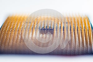 Abstract macro photo of a gold and black computer CPU