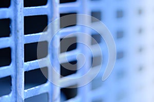 Close up blue fence with square grid pattern