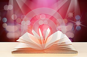 Abstract magic light on open book  for science and education or religion background