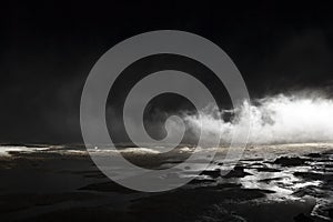 Abstract mars like terrain, muddy puddles of water textures, rocks, heavy fog