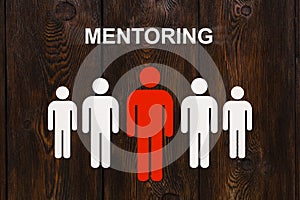 Abstract mentoring concept. Paper red mentor and white men figures