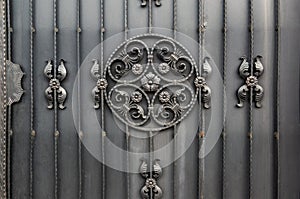 Abstract metal forged black background. Metal gates. Close -up