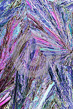 Abstract micrograph of ascorbic acid crystals in brilliant array