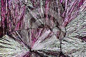 Abstract micrograph of ascorbic acid crystals in brilliant array