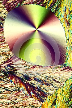 Abstract micrograph of ascorbic acid crystals in brilliant array