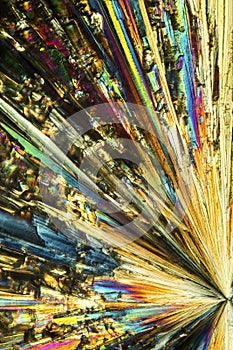 Abstract micrograph of a radiating burst of lysine crystals.