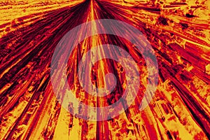 Abstract micrograph of bright red and orange pattern of lysine c