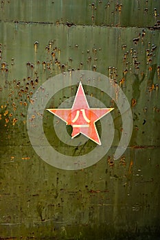 Abstract military green background with red star.