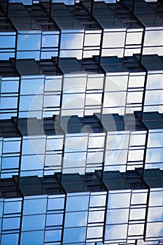 Abstract mirrored reflective geometric 3d background. Scales building. Blue reticulated facade