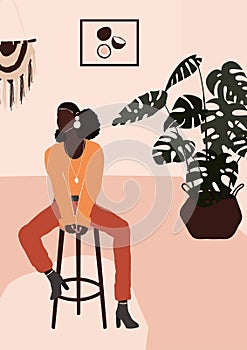 Abstract modern african american black woman in fashion trendy clothes sitting on chair in room