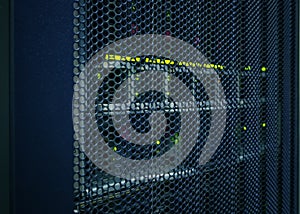 Abstract of modern high tech internet data center room with rows racks network and server hardware.