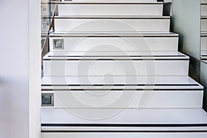 Abstract modern white stairs with non-slip line pattern