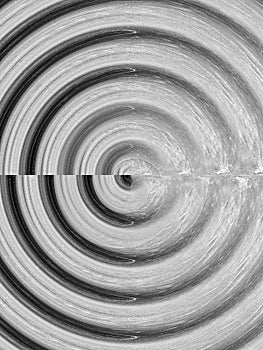 Monochrome spiral pattern with textured concentric circles effect