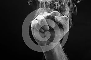 Image of a fist and smoke