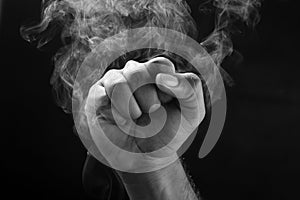 Image of a fist and smoke