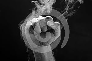 Image of a fist and smoke