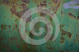 Abstract, moody wall texture background. Green and brown surface. Creative backdrop design. Rusty metal wall fragment. Old iron
