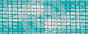 Abstract mosaic of squares in blue and white tones