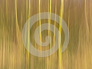 Abstract motion blur background in soft brown and yellow with vertical lines.