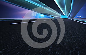 Abstract motion blur effect fast forward moving asphalt tunnel road