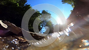 Abstract moving blurred background. Flowing water of mountain river below