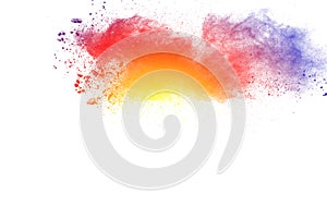 Abstract multi color powder explosion on white background.