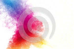 Abstract multi color powder explosion on white background.