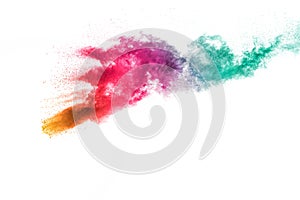 Abstract multi color powder explosion on white background.Freeze motion of dust particles splash